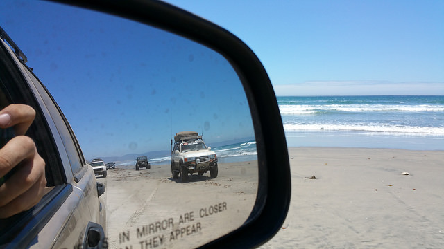 1990 Toyota Land Criser Jeep Cherokee Tundra in the mirror on the beach in Baja.jpg